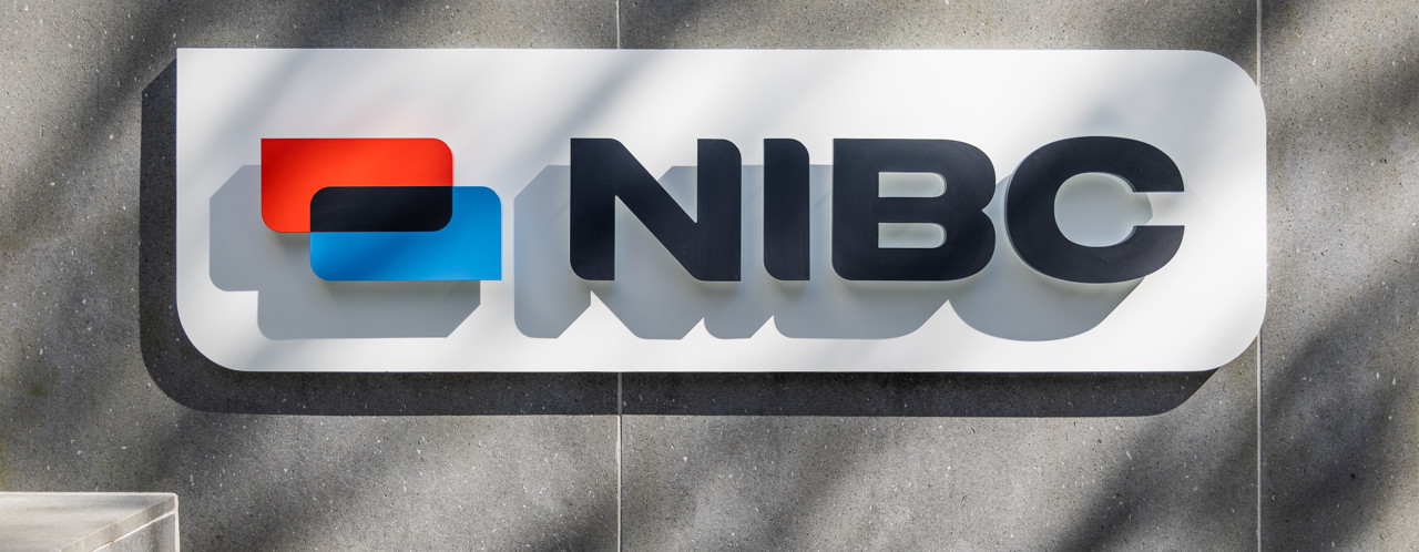 NIBC logo featuring a blue-red square and bold black letters on a gray background.