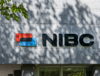 NIBC logo featuring a blue and red block shape on the left side against a gray background.